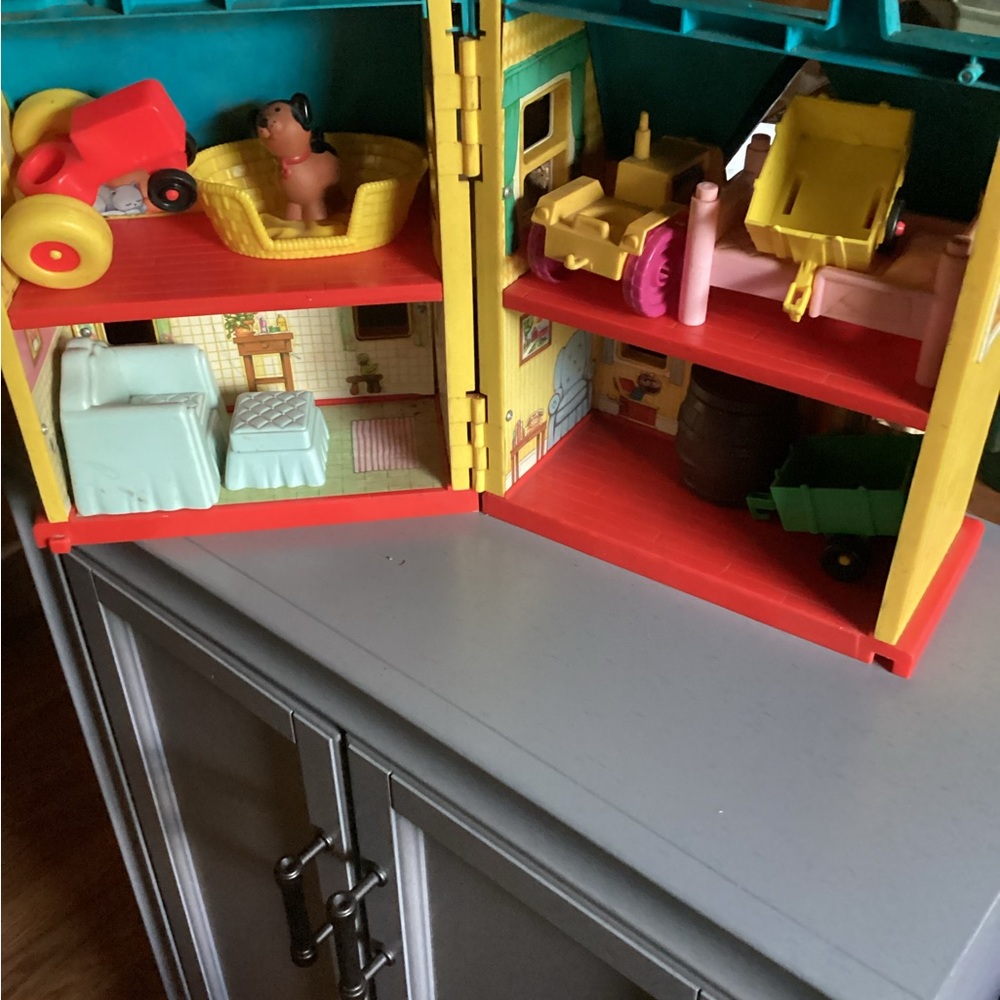 Portable playhouse with carry handles.